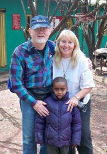 Cliff and Mary with Yonus, who has HIV/AIDS.