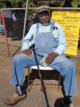 man sitting with a cane