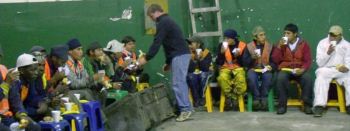 Serving dinner to the night workers at Zambiza dump