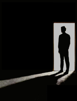 silhouette of a man in a doorway